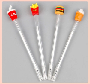 Detail of four creative novelty pens with cola, fries, burger and ice cream silicone caps