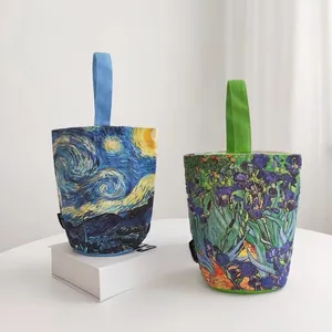 Detail of canvas bucket bags featuring Van Gogh Starry Night and Irises art prints