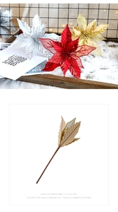 Detail of sequined artificial poinsettia flowers in red, gold, and silver for decor