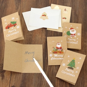 Detail of Christmas cards set with kraft paper cards, envelopes and tree stickers