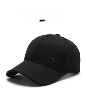 Detail of black baseball cap with metallic logo and breathable textured fabric