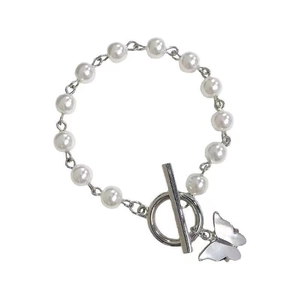 Elegant butterfly pearl bracelet with silver OT buckle and white beads on white background