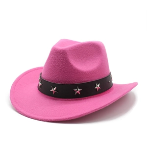 Detail of pink felt cowboy hat with a black leather band and silver star studs