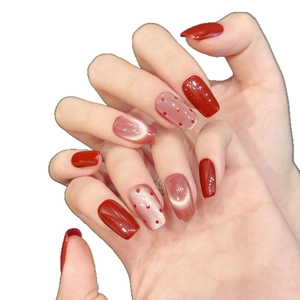 Deep red and pink cat eye press-on nails with polka dot design in short square shape