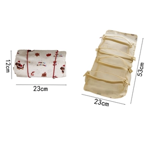 Foldable Christmas roll-up makeup bag with four mesh pockets and holiday dog print