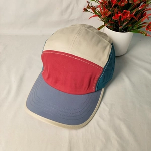 Top view of a five-panel color-block baseball cap with contrast stitching detail