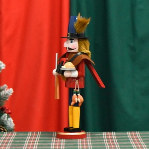 Classic wooden nutcracker soldier with rifle and tray on a festive Christmas background