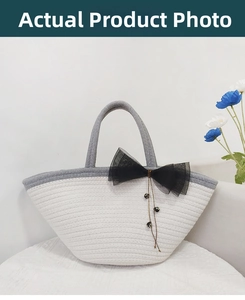 Detail of hand-woven tote bag featuring a large black mesh bow and bead accents