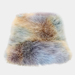 Close-up of colorful tie-dye faux fur bucket hat with long plush texture for winter