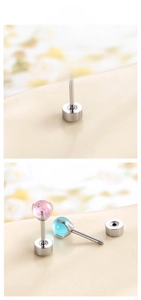 Macro detail of dopamine style dragon ball stud earrings with secure screw-back design