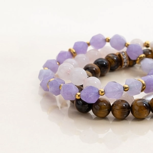 Layered beaded bracelet with tiger eye stones, purple faceted beads and gold accents