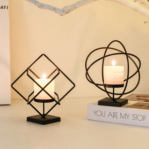 Modern black geometric iron candle holders with white scented candles for home decor