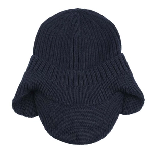 Detailed close-up of dark blue winter knitted hat with ear flaps and a short brim