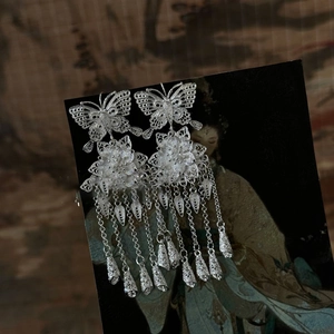 Silver hollow butterfly flower drop tassel earrings in a vintage traditional style