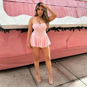 Detail of pink strapless pleated mini dress with corset waist and ribbed texture