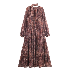 Boho brown paisley print maxi dress with deep V-neck, halter neck and ruffled skirt
