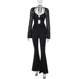 Detail of elegant black lace long sleeve romper with cutout neckline and flare leg