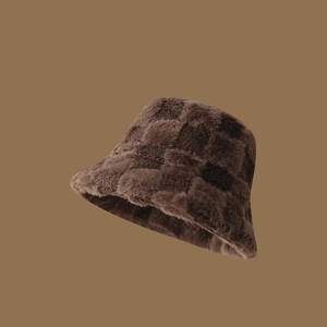 Close-up of fluffy checkered bucket hat in brown plush texture with soft faux fur detail