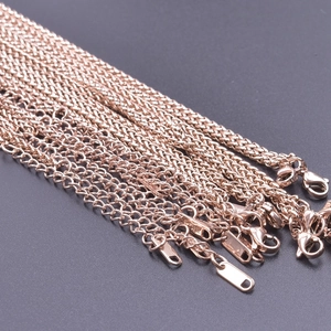 Detail of rose gold 2.5mm dragon bone chains with lobster clasps and extension links