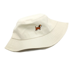 Detail of cute puppy embroidery on beige cotton bucket hat for women's sun protection