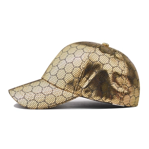 Golden cotton baseball cap with a geometric hexagonal honeycomb texture and metallic finish