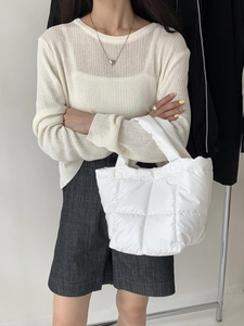 Minimalist white quilted puffer handbag featuring soft square pattern in casual style