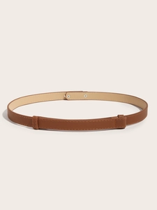 Detailed view of brown Saffiano leather belt with gold buckle on beige background