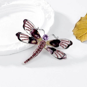Exquisite dragonfly brooch with purple enamel wings and crystals in a 45-degree view