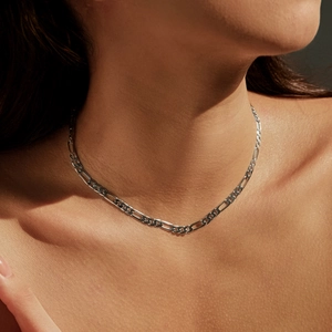 Minimalist S925 sterling silver Figaro chain necklace for women worn on a fashion model
