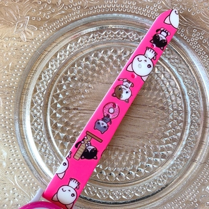 Pink silicone watch strap with cute cartoon kittens and donuts on a glass plate