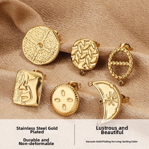 Macro view of six diverse 14K gold plated stainless steel earring components on fabric