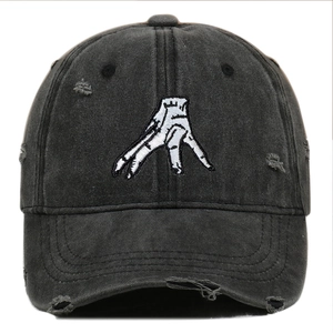Vintage washed black baseball cap with white hand embroidery and distressed ripped details