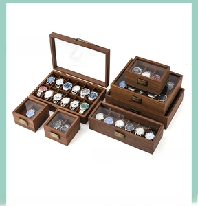 Multiple sizes of walnut wood watch display boxes with glass windows and metal locks