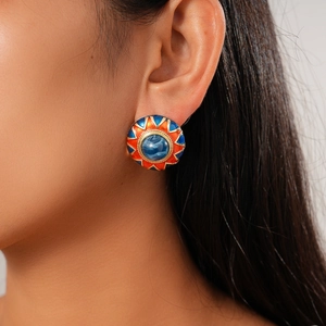Retro geometric round resin floral stud earrings with blue center gem on model