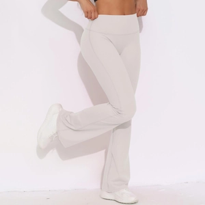 Detail of high waist tummy control and flared leg on light grey yoga pants
