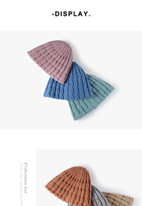 Multiple colors of thick jacquard knit fisherman hats showing textured crochet patterns