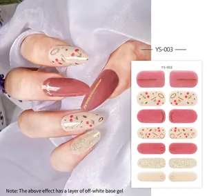 Detail of cherry pattern nail stickers with dark red accents and glitter finish