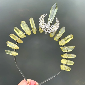 Handcrafted crown headband featuring natural yellow crystal points and a silver moon ornament