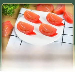 Close-up of realistic artificial tomato slices for food photography and home kitchen decor