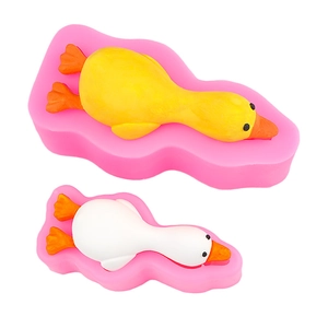 Pink silicone duck molds for DIY chocolate and cake baking with finished duck models