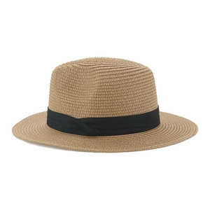 Close-up of fine woven paper straw texture and black ribbon on a khaki Panama hat