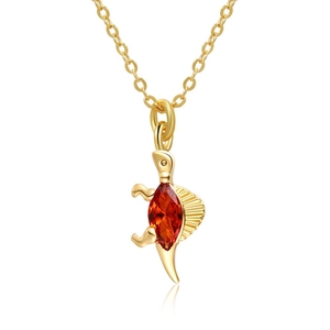 Detail of 18K gold plated necklace with a dinosaur pendant and red crystal stone