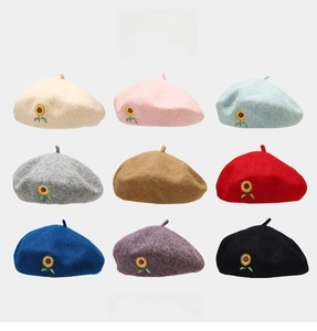 Detail view of 9-color wool beret collection featuring exquisite sunflower embroidery motifs