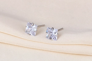 Close-up of square-cut cubic zirconia stud earrings in s925 silver setting