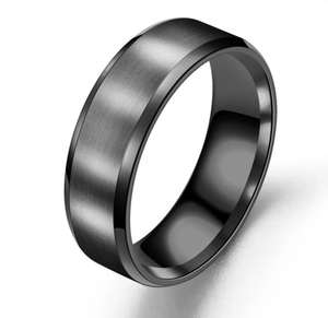 Detail of matte black brushed stainless steel ring with polished beveled edges