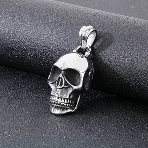 Gothic skull pendant in stainless steel with retro rock style on a dark background