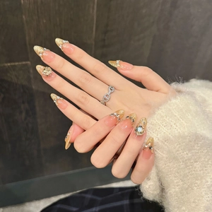 Sparkling champagne rose cat-eye press-on nails with golden glitter French tips