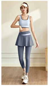 Detailed view of light blue fitness tank top and grey yoga leggings with white waistband