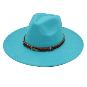 Close-up of turquoise felt fedora hat featuring a brown woven band with leaf detail