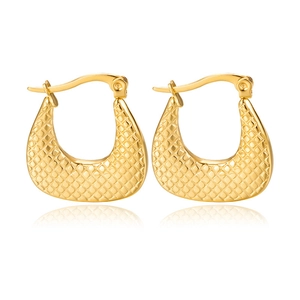 Detail shot of golden U-shaped earrings with high-polish grid pattern texture